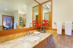 Master Bath tub is high-end remodel with large soaking tub, two separate vanities, custom lighting and private toilet